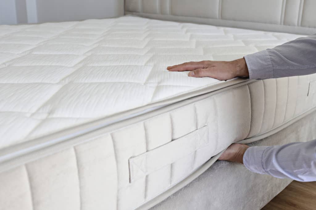 testing the firmness of a mattress