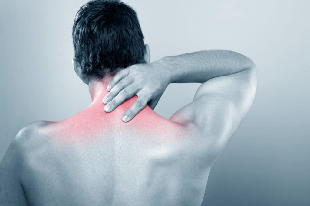 pinched shoulder nerve causing pain black and white picture with red showing pain